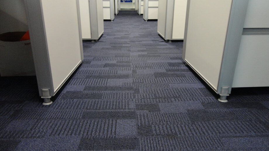 Commercial carpet in an office building with cubicles.