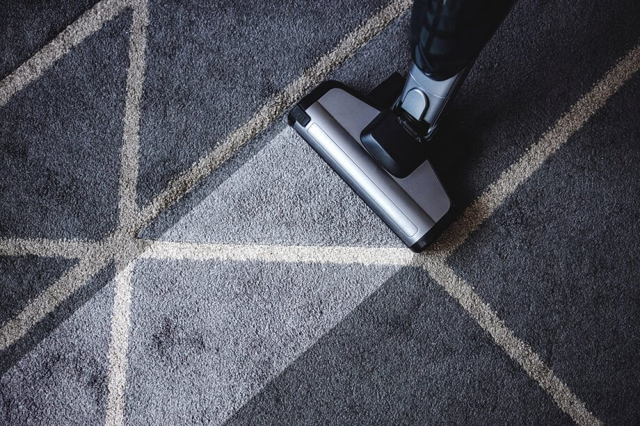 vacuum mark on grey rug showing dirty/clean difference