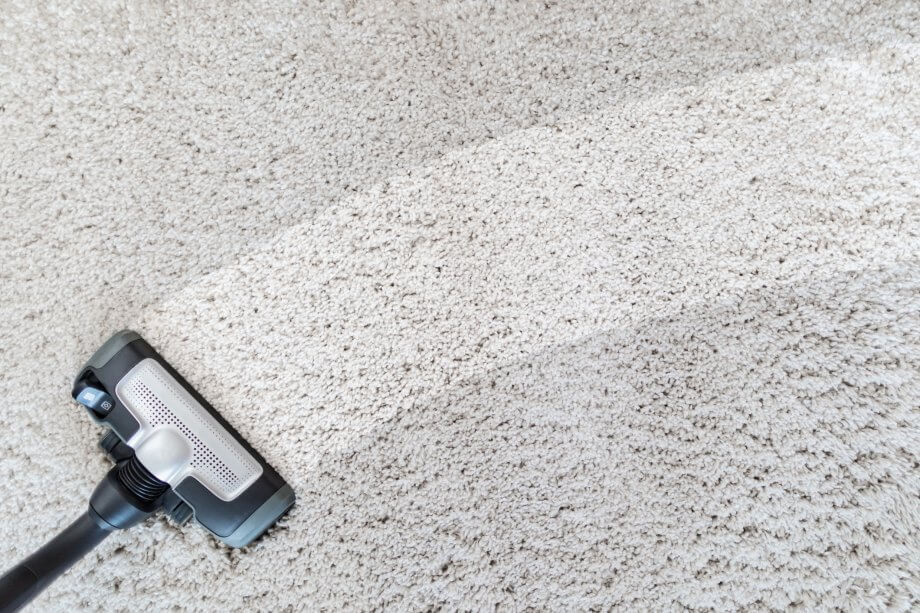close up of a light gray carpet being cleaned